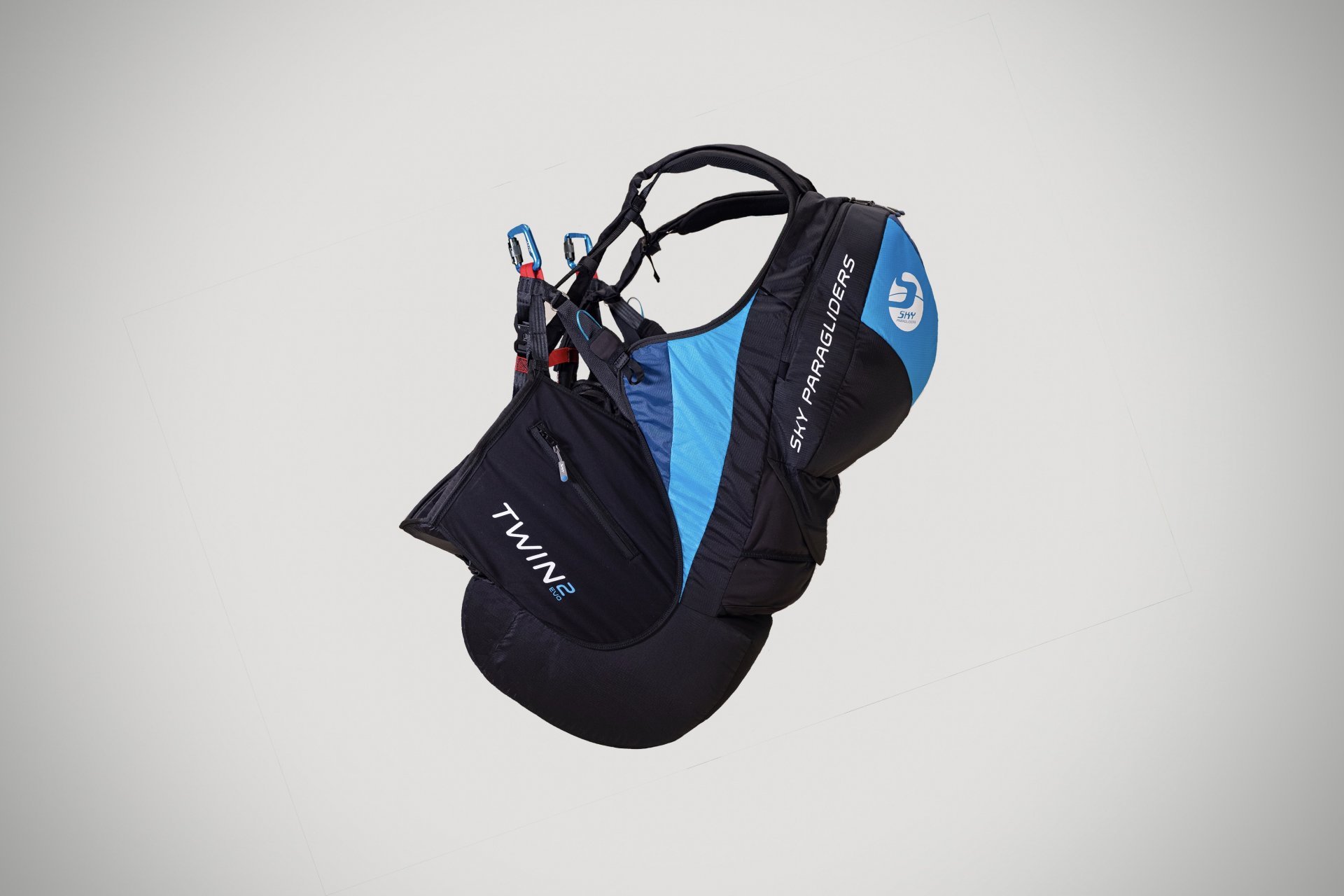 Tandem paragliding gear and harness in use.