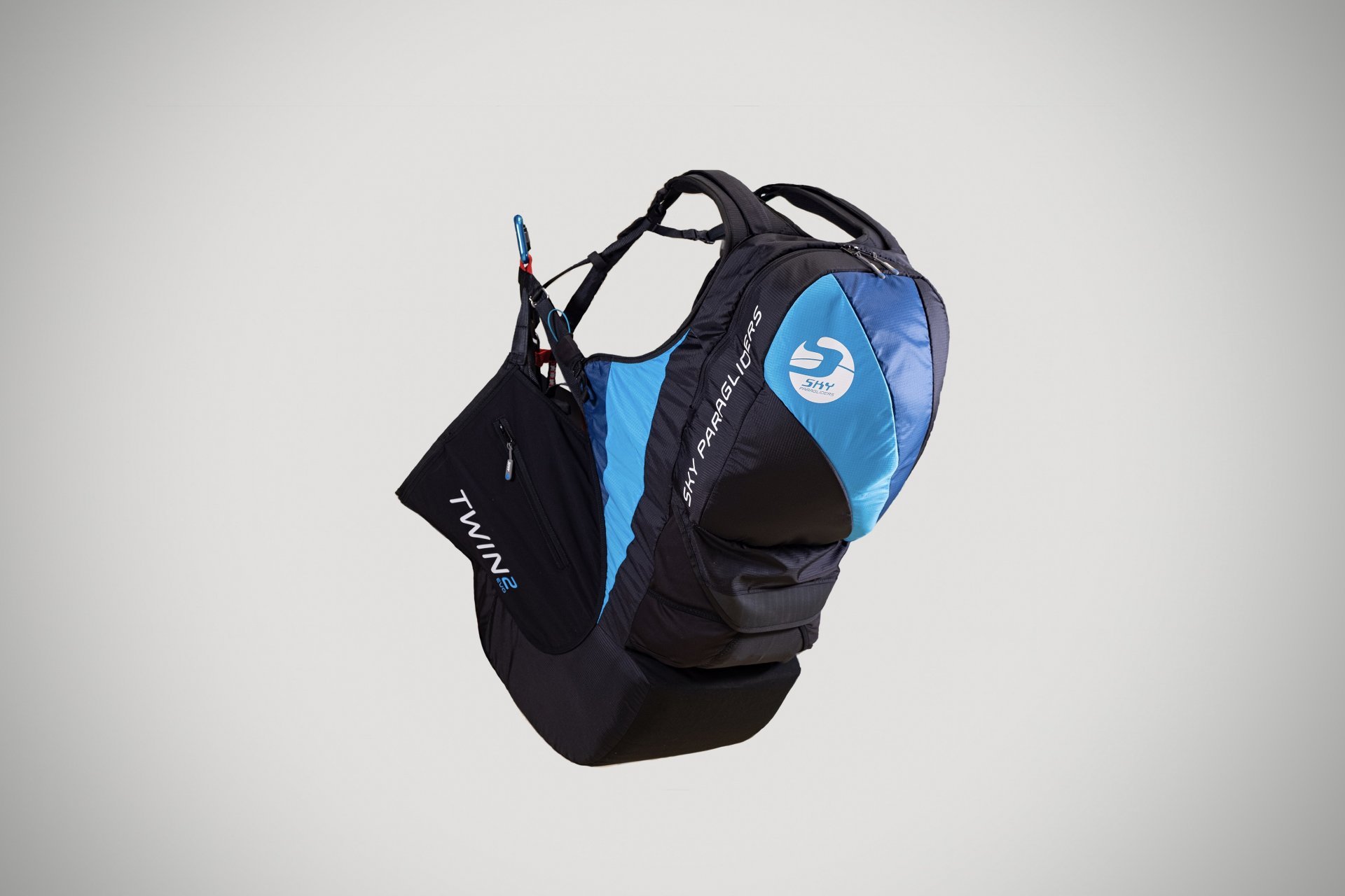 Tandem paragliding gear and harness in use.