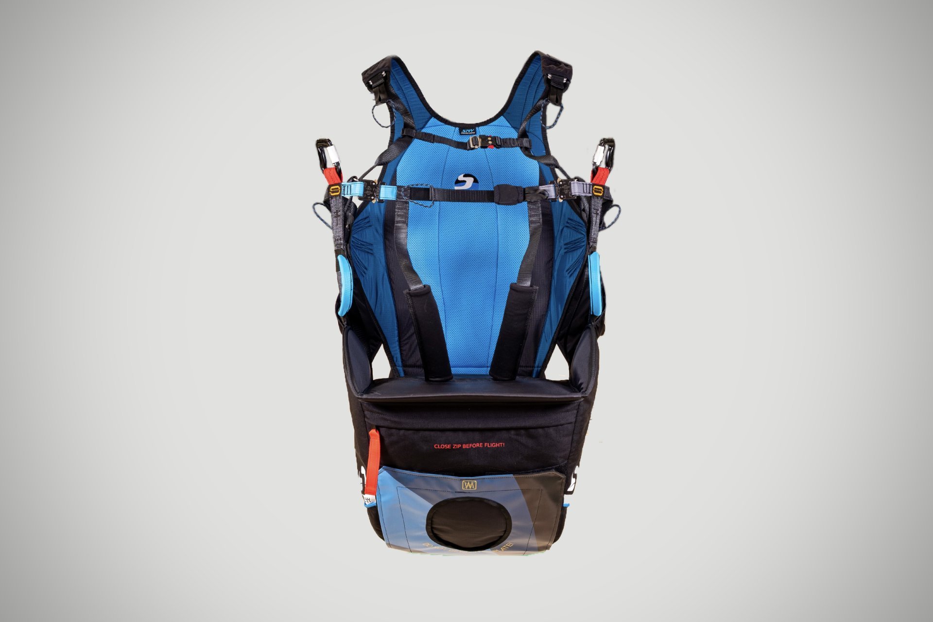 Paragliding passenger harness and safety setup.