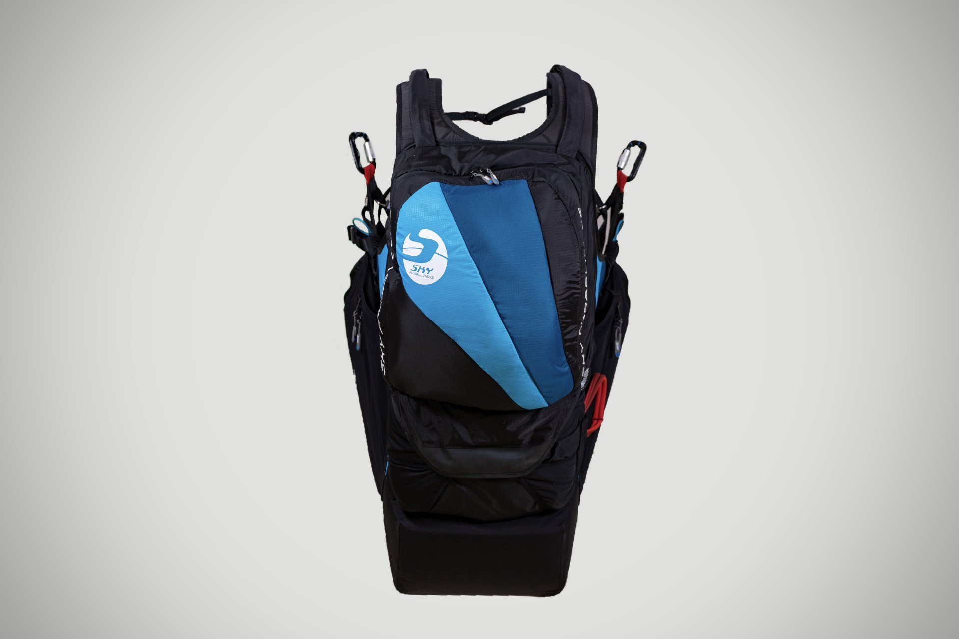 Tandem paragliding gear and harness in use.