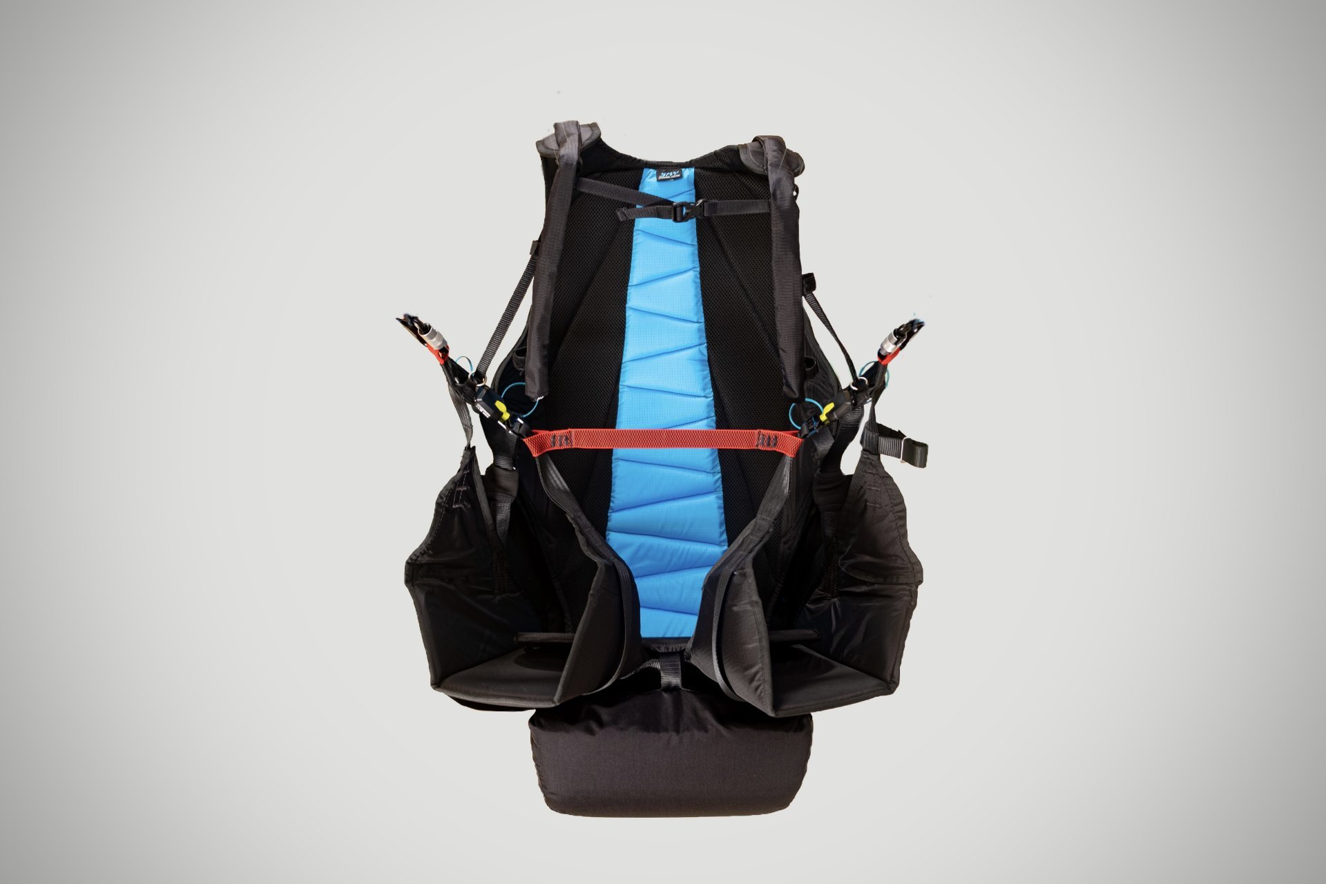 Tandem paragliding gear and harness in use.