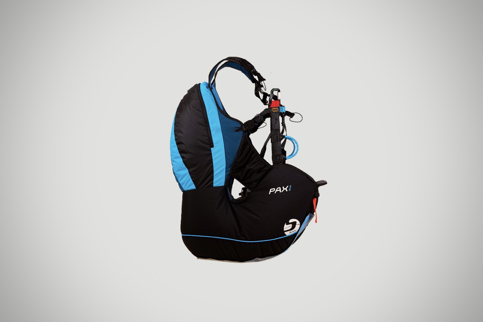 Paragliding passenger harness and safety setup.